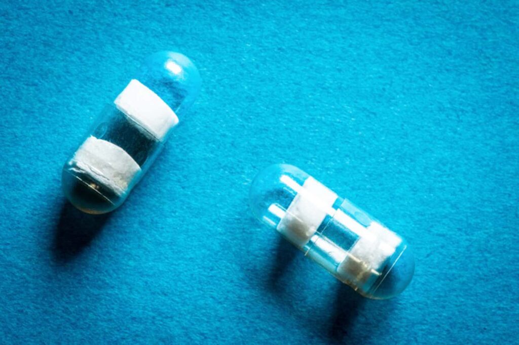 Capsules without medications, showcasing the compartment barriers made of pH-responsive polymer. Credit: David Baillot/UC San Diego Jacobs School of Engineering